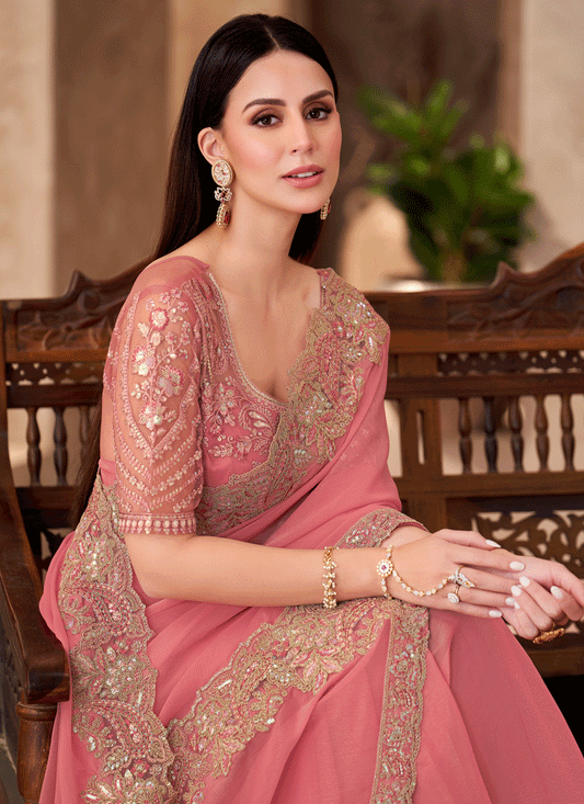 Charming Peach Georgette Heavy Designer Saree