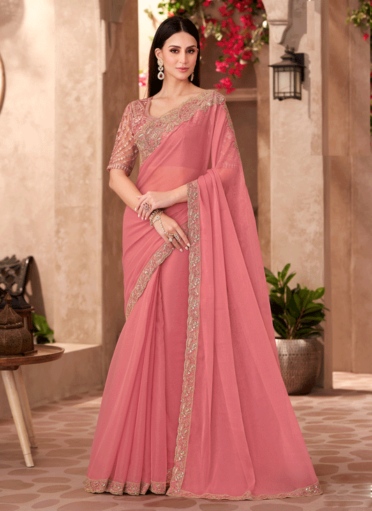 Charming Peach Georgette Heavy Designer Saree