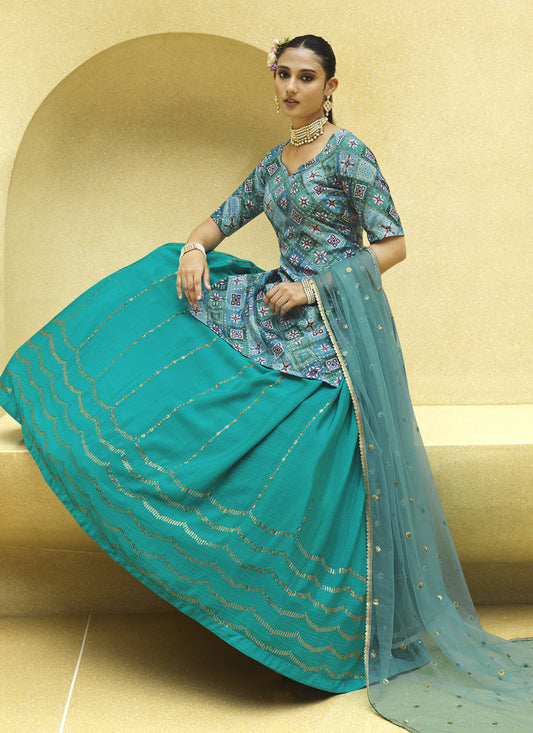 Vibrant Firozi Chinnon Silk Embellished Designer Lehenga Kameez