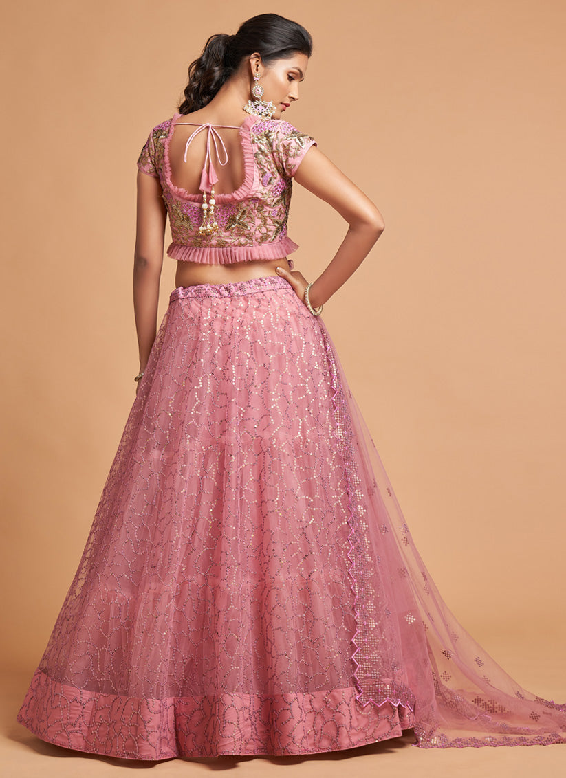 Ravishing Carnation Pink Net Embroidered Designer Lehenga Choli