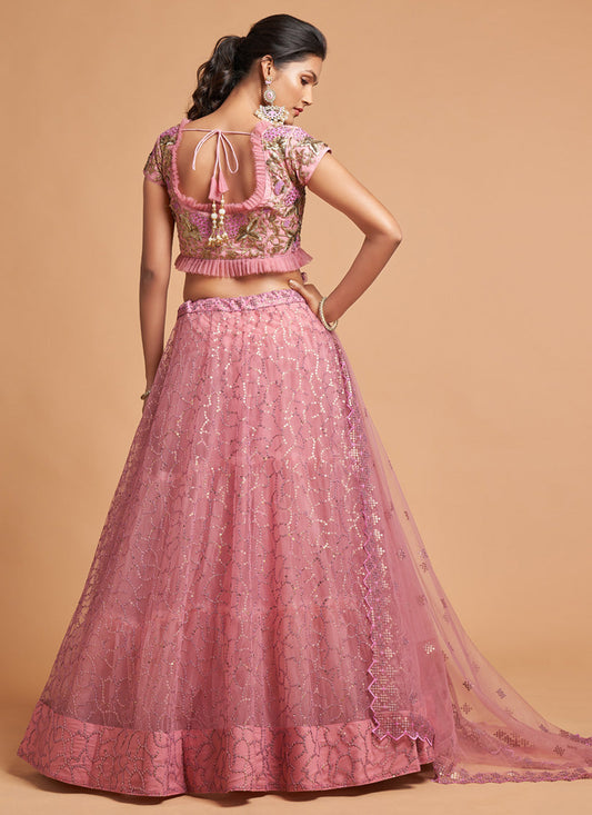 Ravishing Carnation Pink Net Embroidered Designer Lehenga Choli