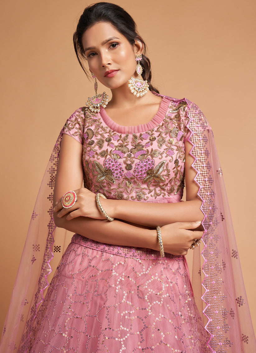 Ravishing Carnation Pink Net Embroidered Designer Lehenga Choli