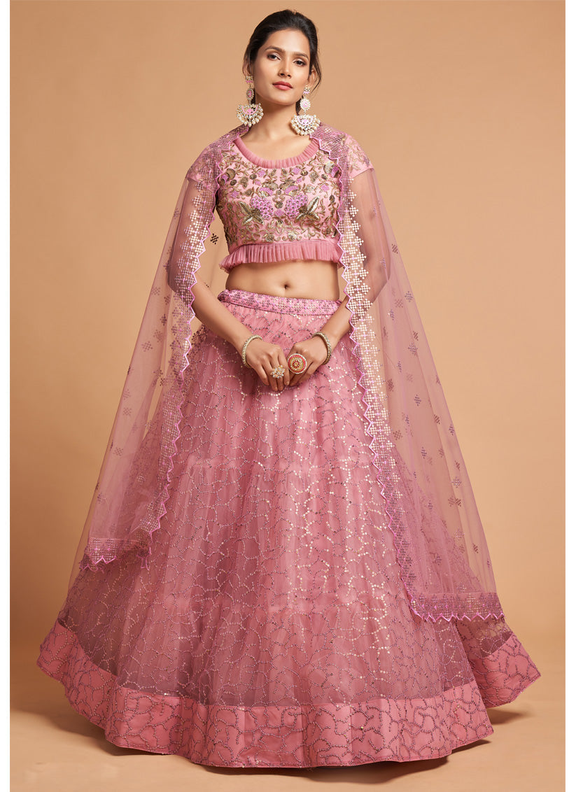 Ravishing Carnation Pink Net Embroidered Designer Lehenga Choli