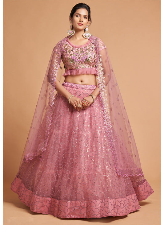 Ravishing Carnation Pink Net Embroidered Designer Lehenga Choli