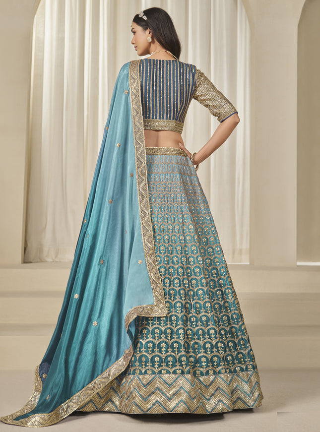 Bewitching Teal Blue Heavy Embroidered Premium Chinnon Silk Lehenga Choli Set