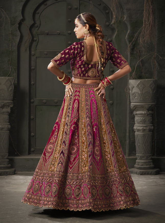 Rani Pink and Musterd Velvet Hand Embroidered Bridal Lehenga Choli