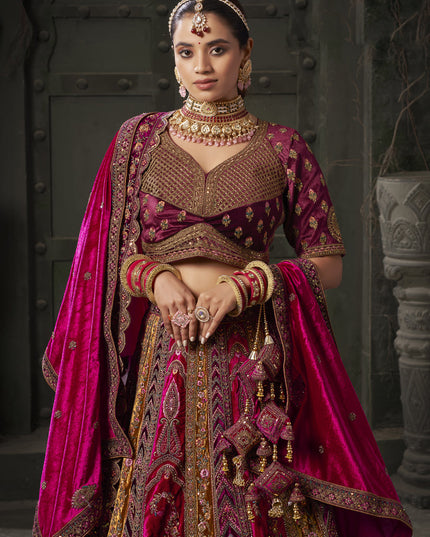 Rani Pink and Musterd Velvet Hand Embroidered Bridal Lehenga Choli