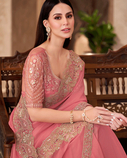 Charming Peach Georgette Heavy Designer Saree