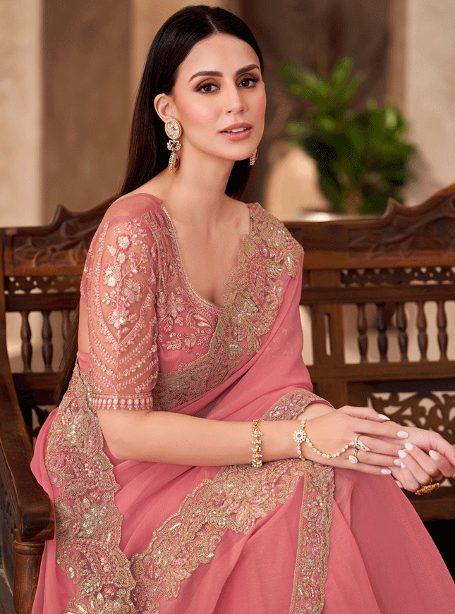 Charming Peach Georgette Heavy Designer Saree