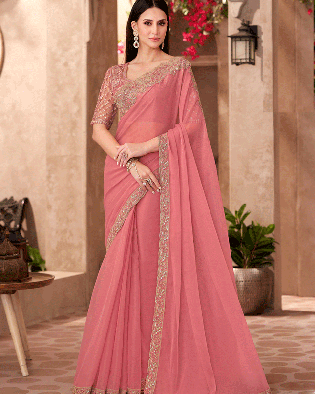 Charming Peach Georgette Heavy Designer Saree