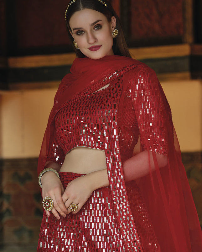 Trendsetting Rust Red Net Sequins Designer Lehenga Choli
