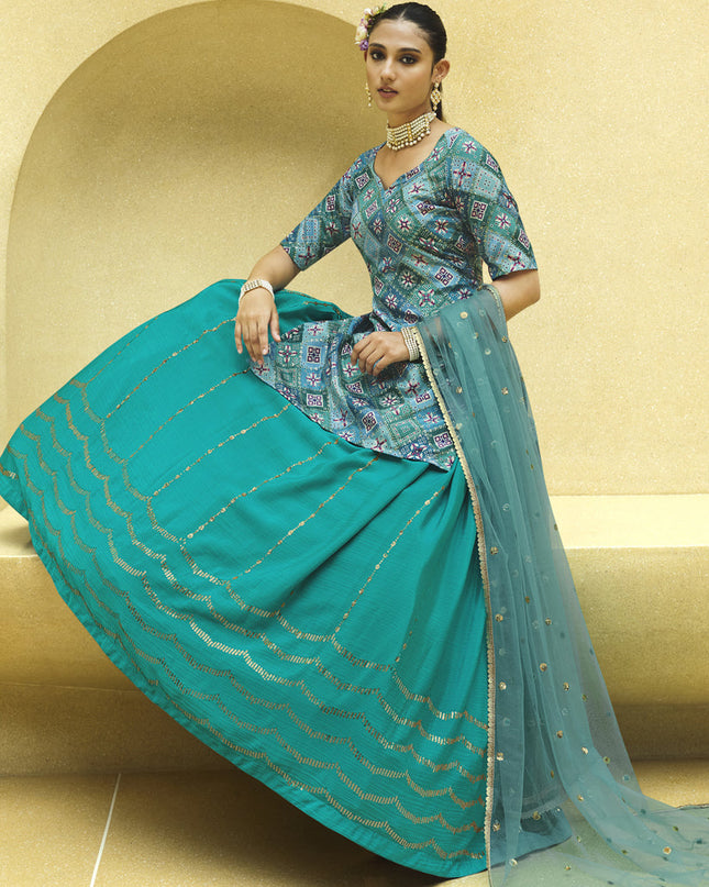 Vibrant Firozi Chinnon Silk Embellished Designer Lehenga Kameez