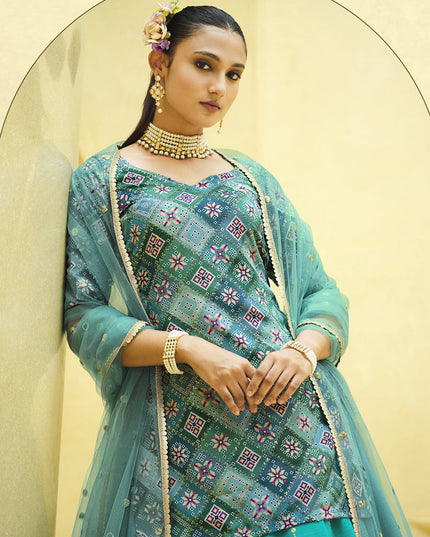 Vibrant Firozi Chinnon Silk Embellished Designer Lehenga Kameez