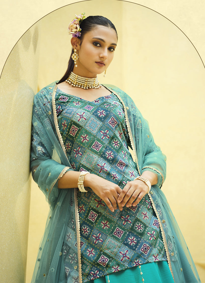 Vibrant Firozi Chinnon Silk Embellished Designer Lehenga Kameez