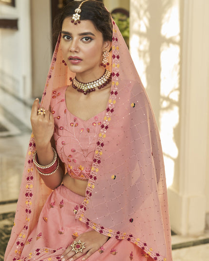 Mesmerizing Strawberry and Peach Art Silk Embroidered Wedding Lehenga Choli