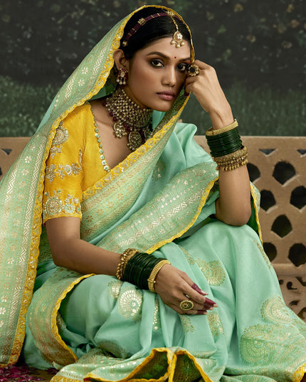 Voguish Turquoise Dola Silk Embroidered Wedding Saree