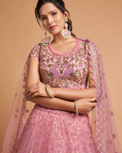 Ravishing Carnation Pink Net Embroidered Designer Lehenga Choli